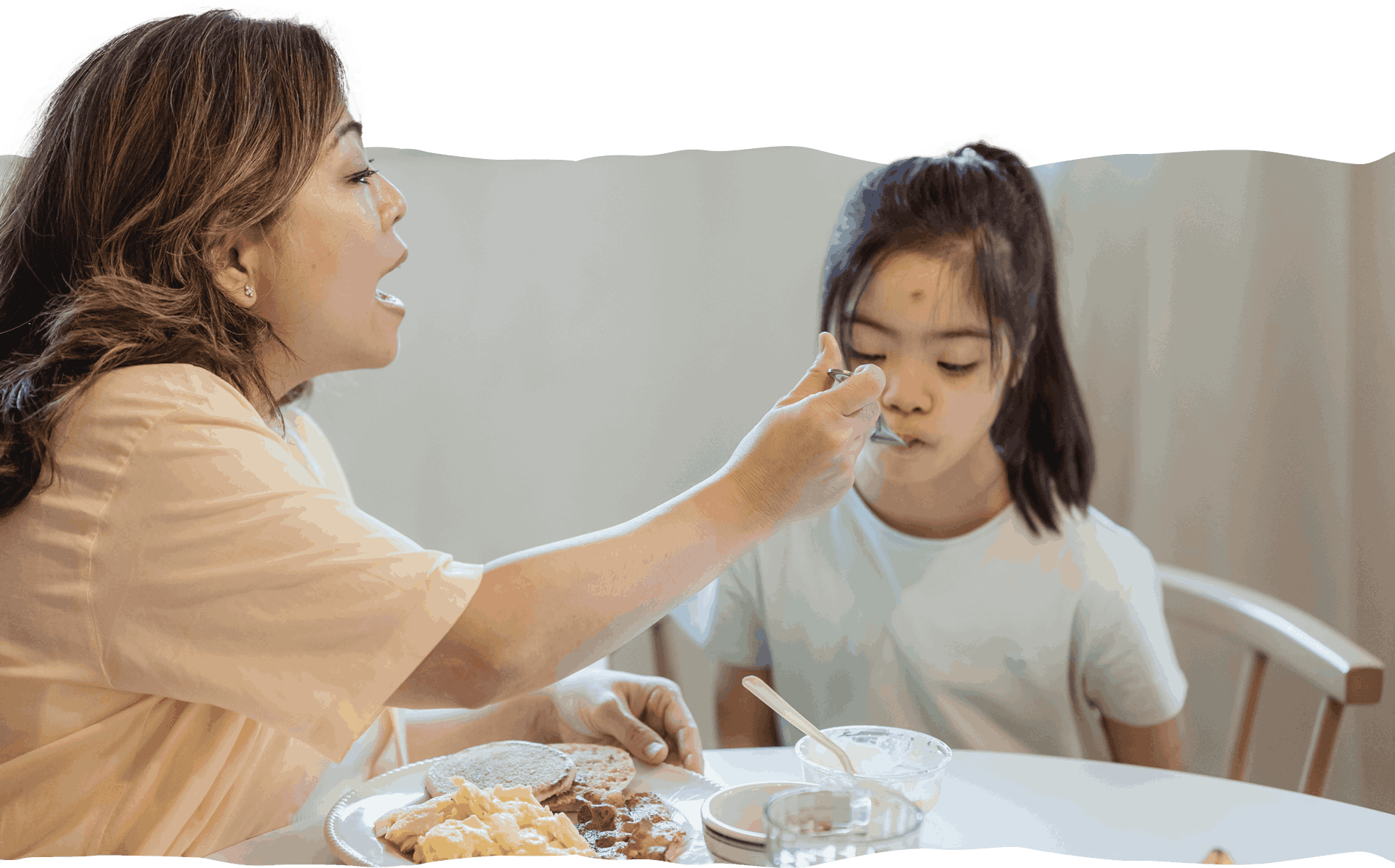 Mother Feeds Kid Girl